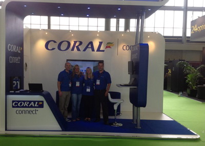 anthony hodgetts working at coral with colleagues at stand during conference