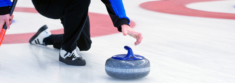 curling player releases stone