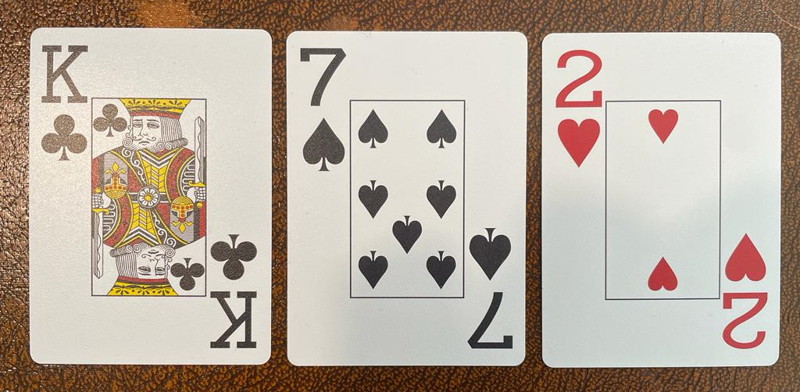 dry board poker king seven two cards off suit