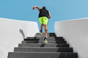 man running up stairs