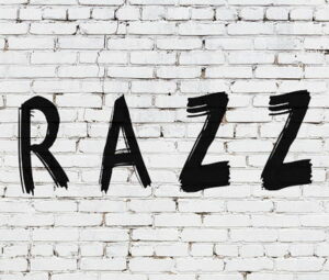 razz written in black on white brick wall