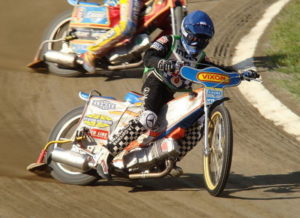 speedway rider in race close up