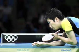table tennis player serving