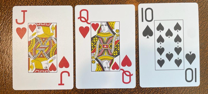 wet board poker queen hearts jack hearts ten clubs cards
